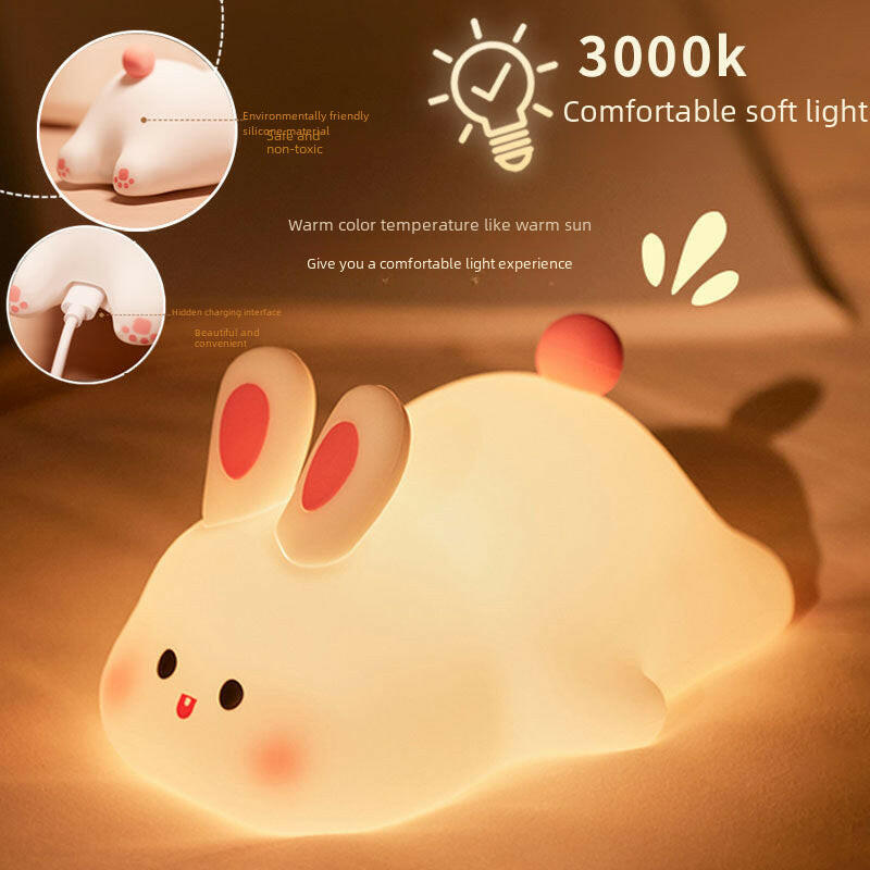 Bunny Glow Pal™ on a study desk with notebooks and a plant