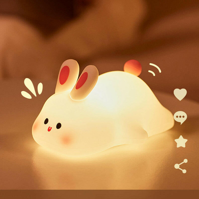 Bunny Glow Pal™ on a study desk with notebooks and a plant