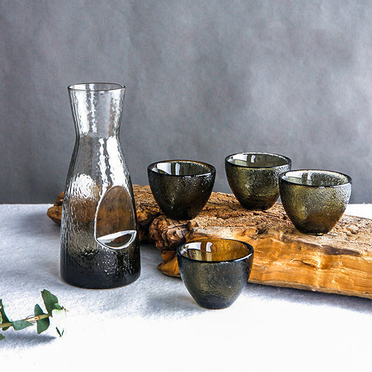 SHOND™ hammered glass sake set with pot and four cups on wooden table