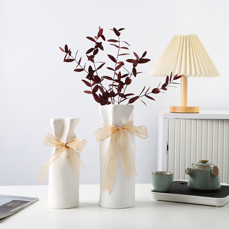Petite crinkled ceramic vase styled on desk