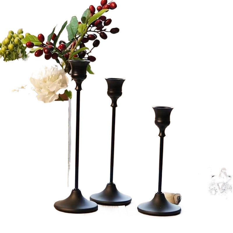 Metal bell-shaped candle holders in matte finishes
