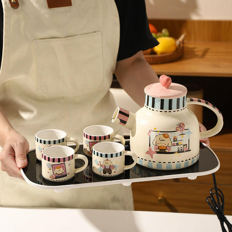 Tea set with thermostatic warming pad displayed
