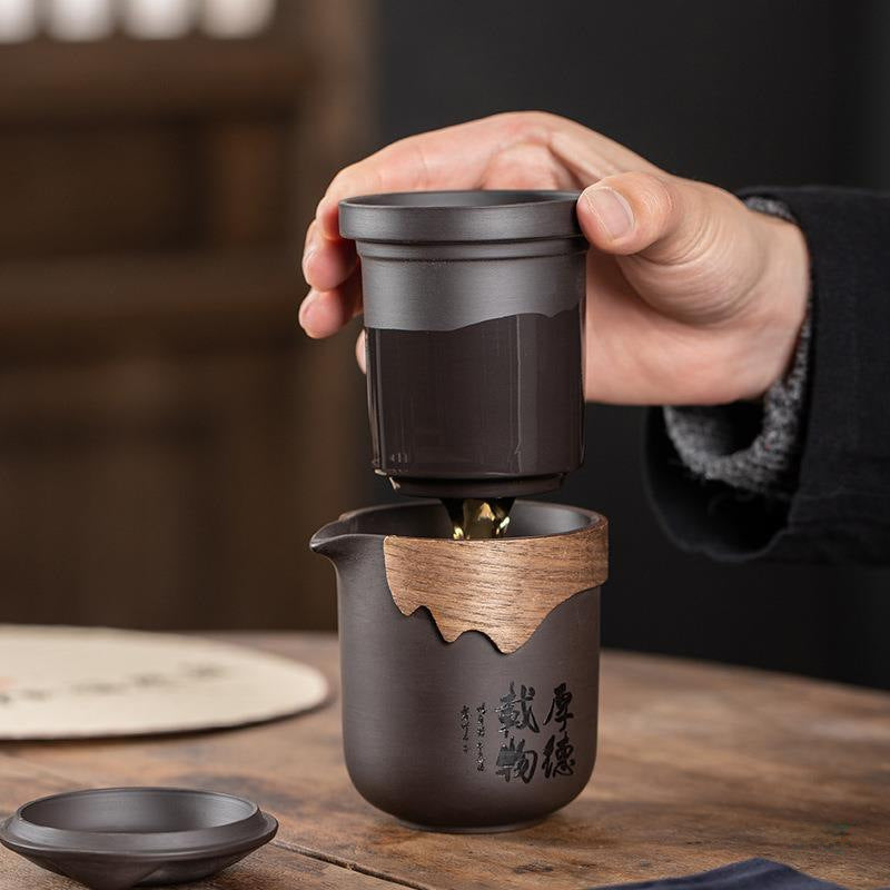 Cups and pot displayed in elegant flat lay with tea leaves
