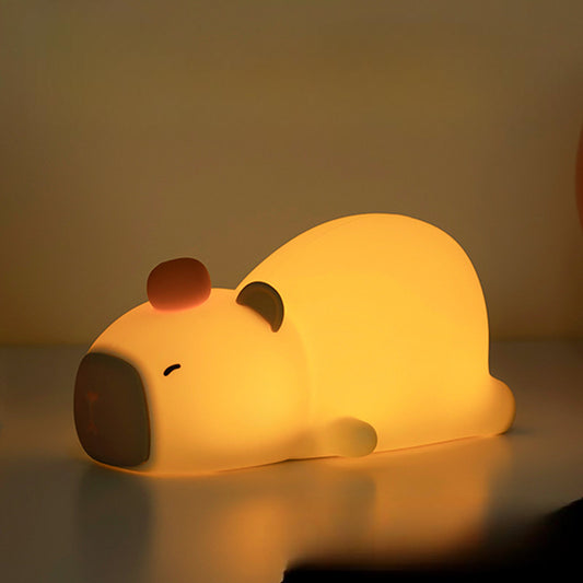 Capybara night light glowing softly in a cozy child’s bedroom setup
