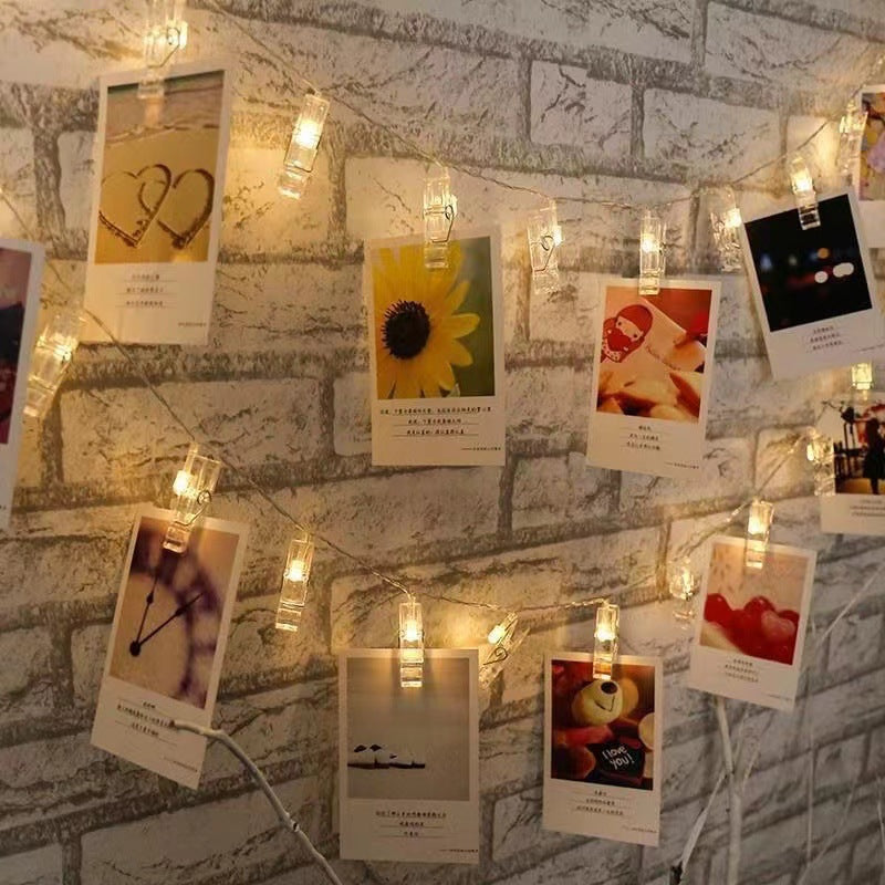 Warm white glow lighting up photos in bedroom setting
