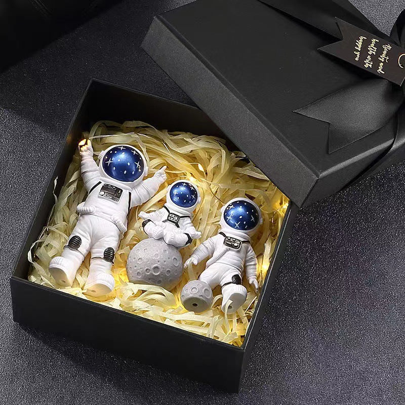 Cute astronaut figurines with oversized helmets
