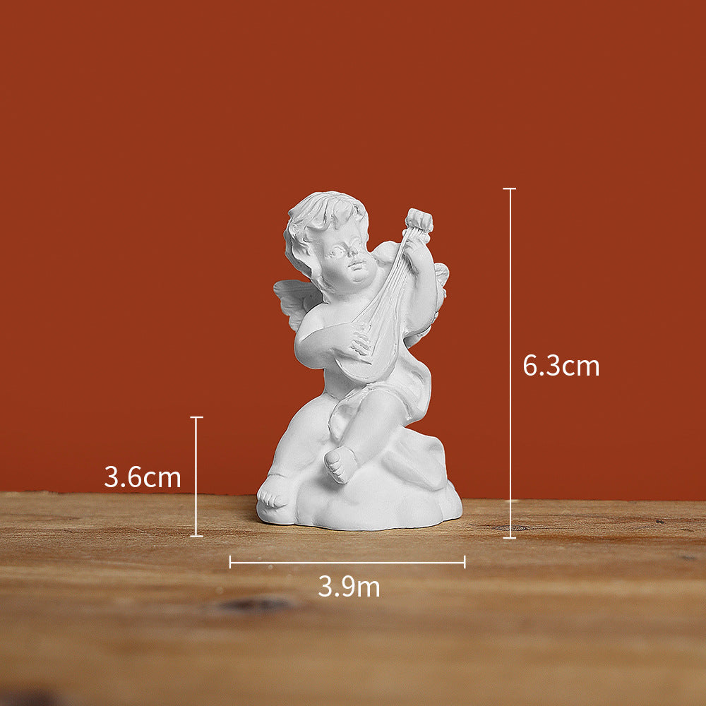 Sculptural angel playing violin
