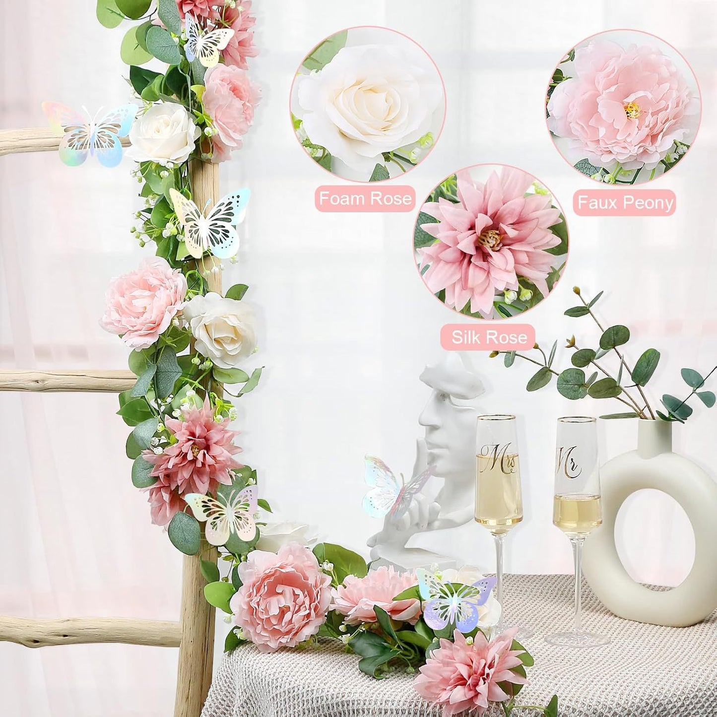 SHOND™ silk rose vine garland draped on a white wall

