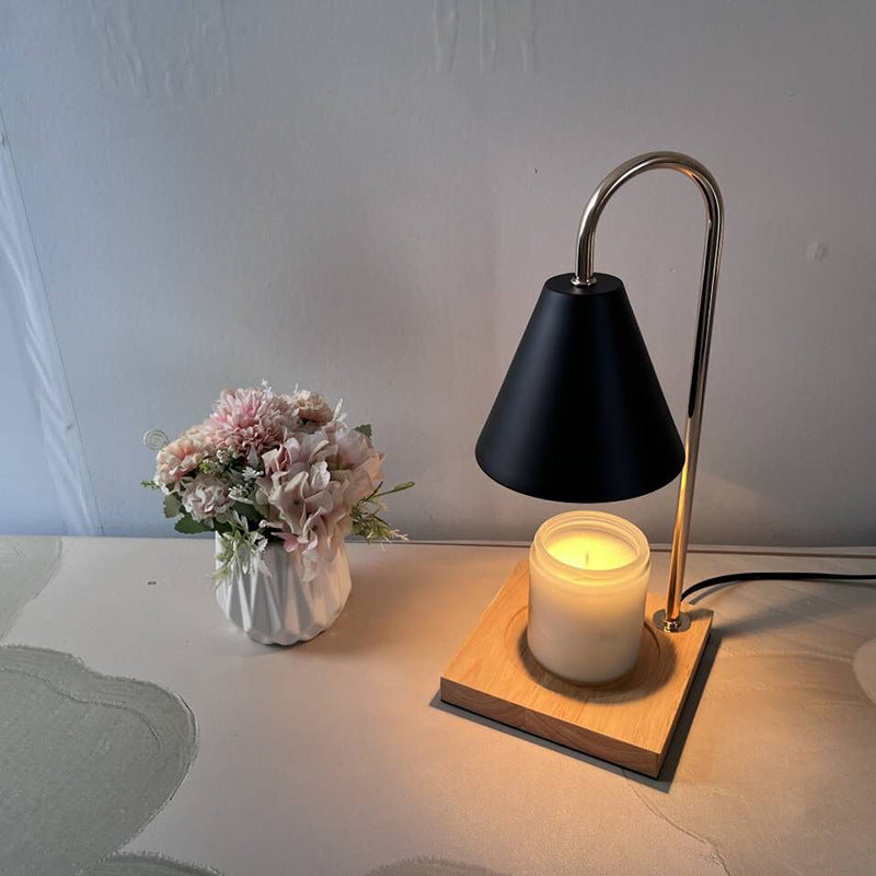 Close-up of gold lampshade and wax melting tray
