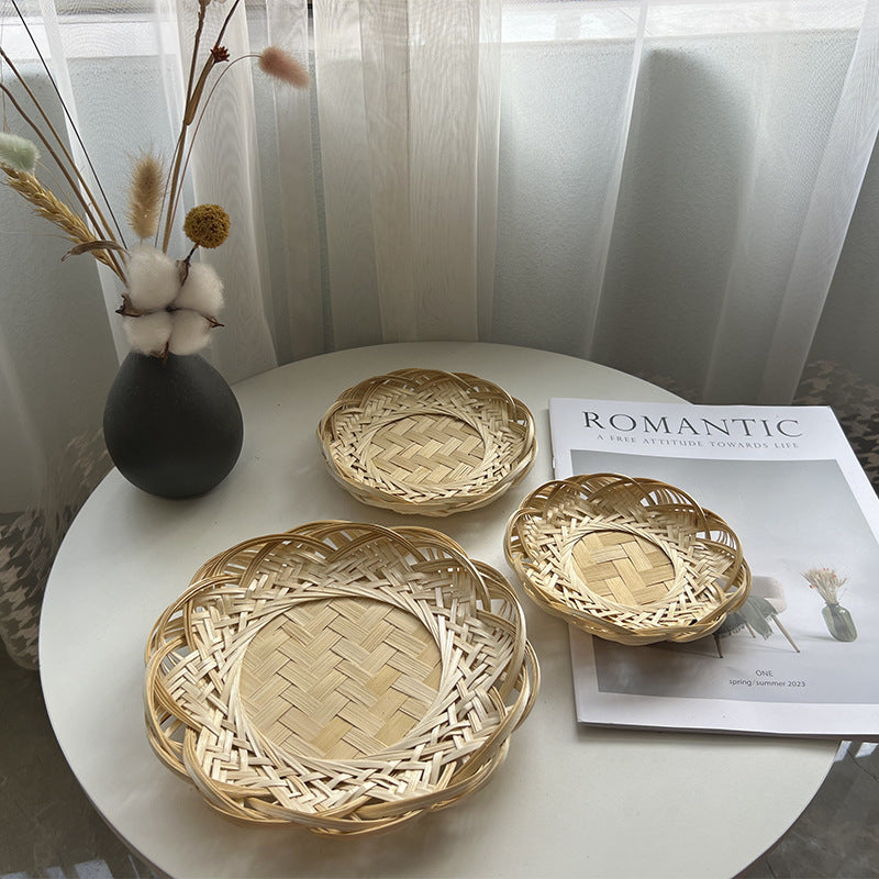 Bamboo lace baskets styled on wooden table with decor
