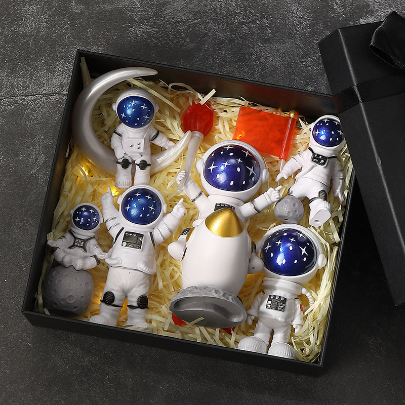 Cute astronaut figurines with oversized helmets
