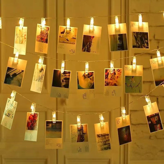 LED photo clip string lights hanging on a dorm wall
