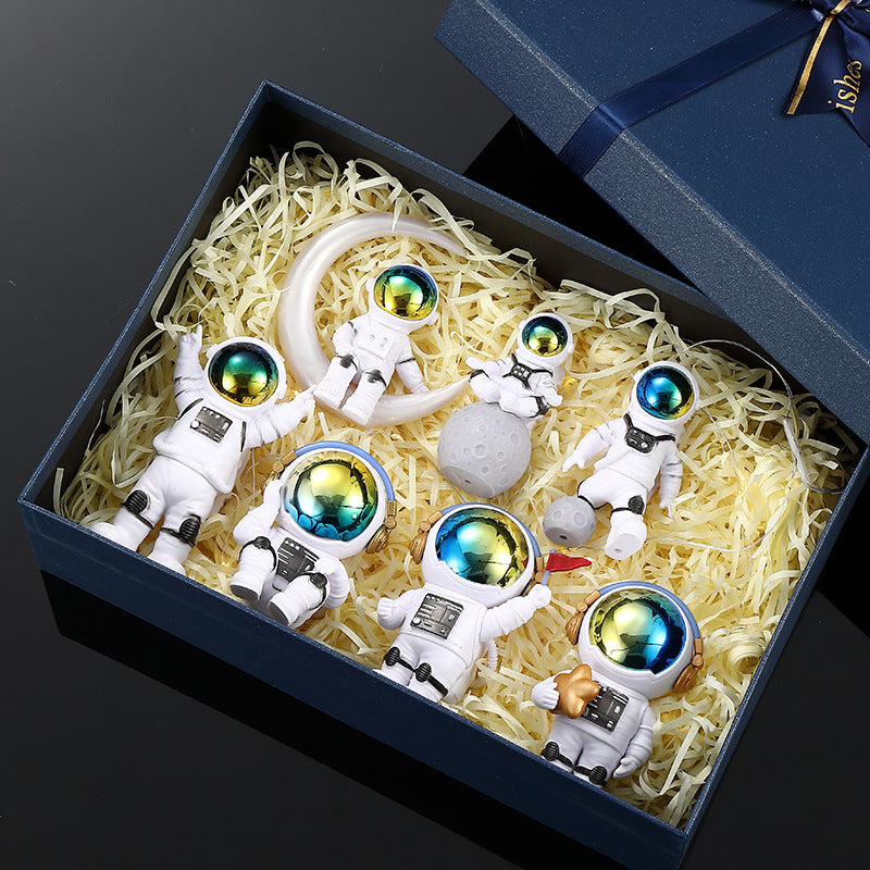 Cute astronaut figurines with oversized helmets
