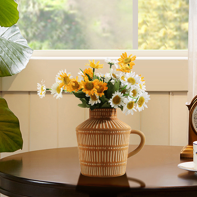 Hand-painted coffee-toned vase styled with dried florals
