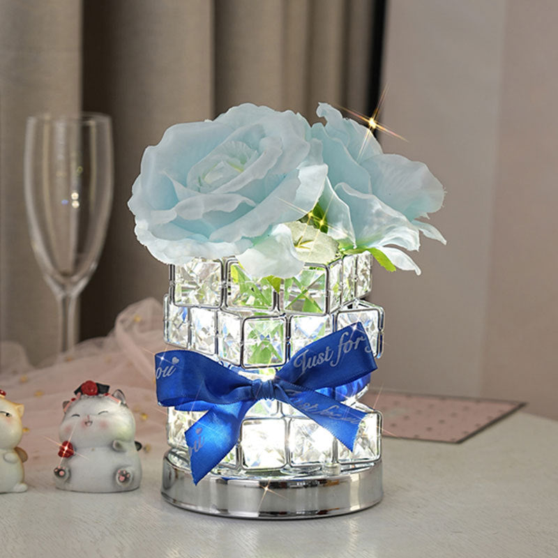 Romantic rose light on a bedside table 
