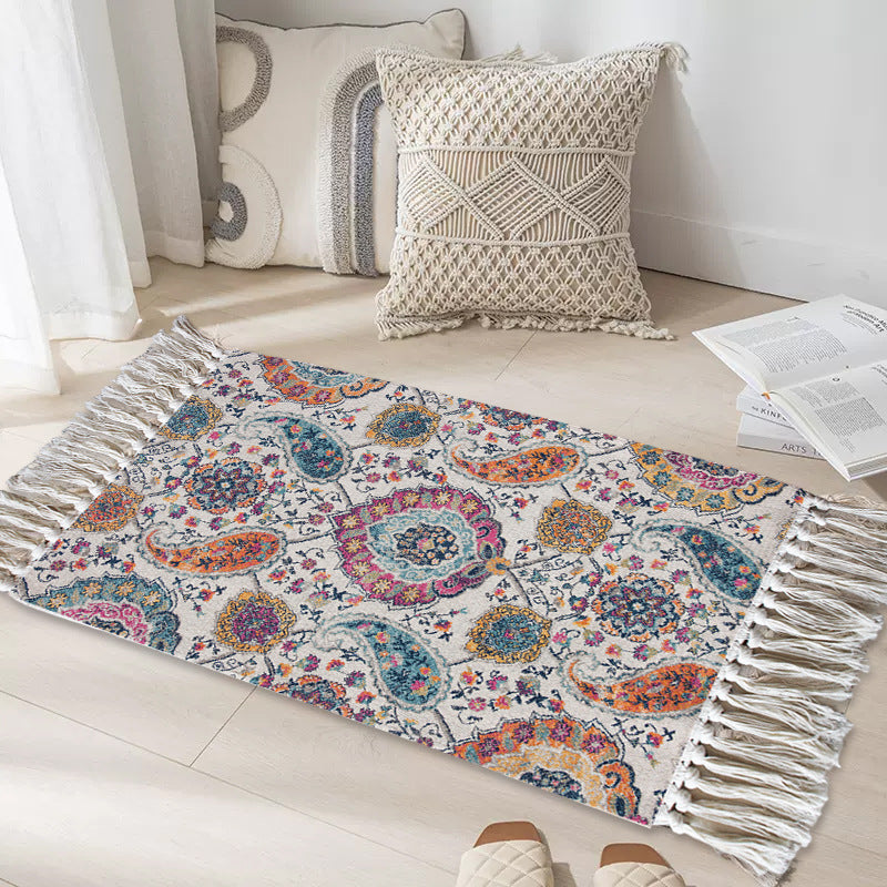 Light ethnic rug with intricate patterning styled on wood flooring
