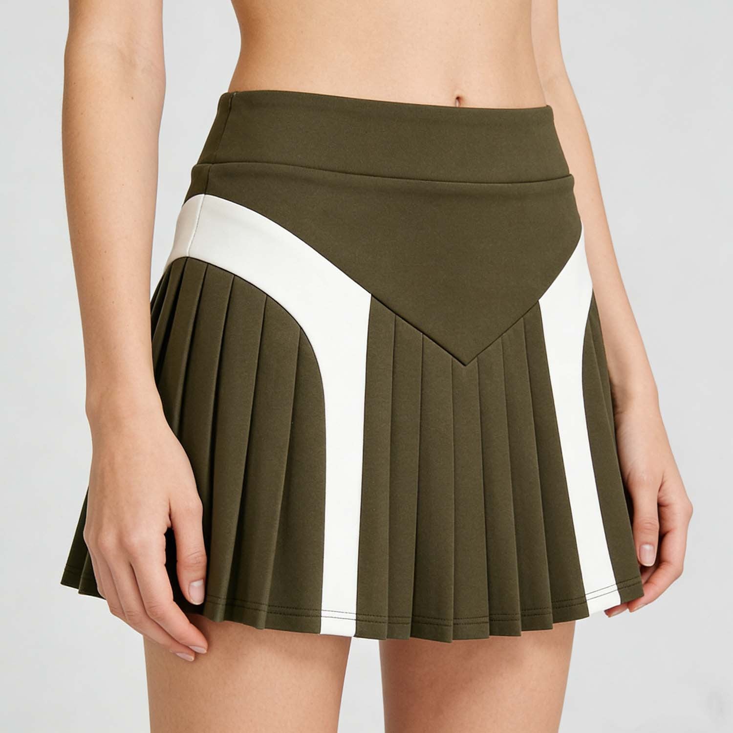 Green pleated skirt with white stripe on a plain background