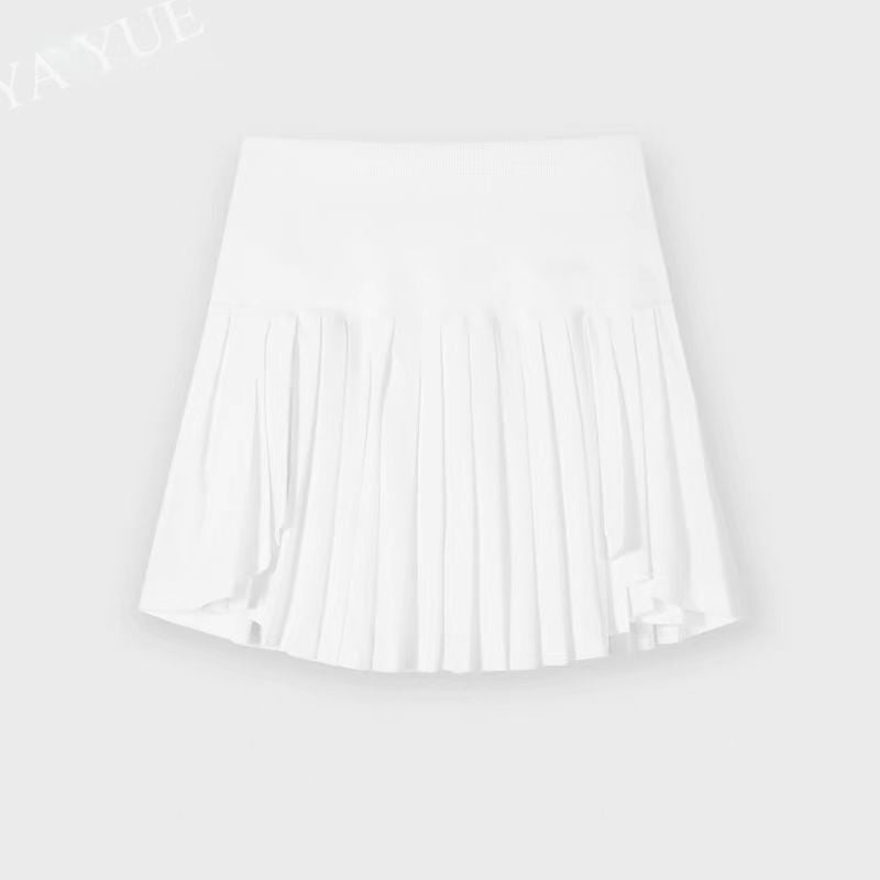 White pleated skirt on a light gray background