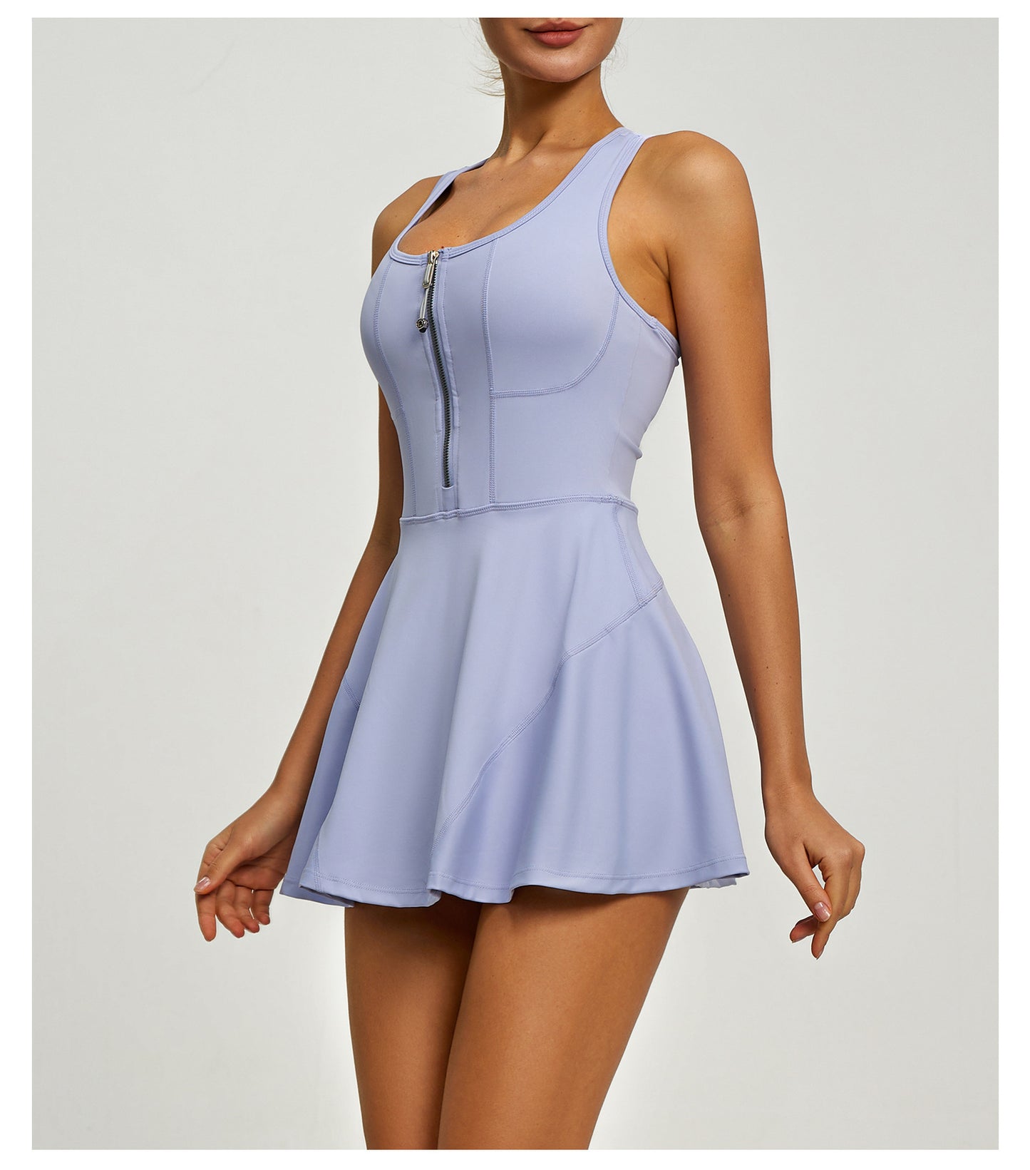 Light purple sleeveless dress with zipper detail on a white background