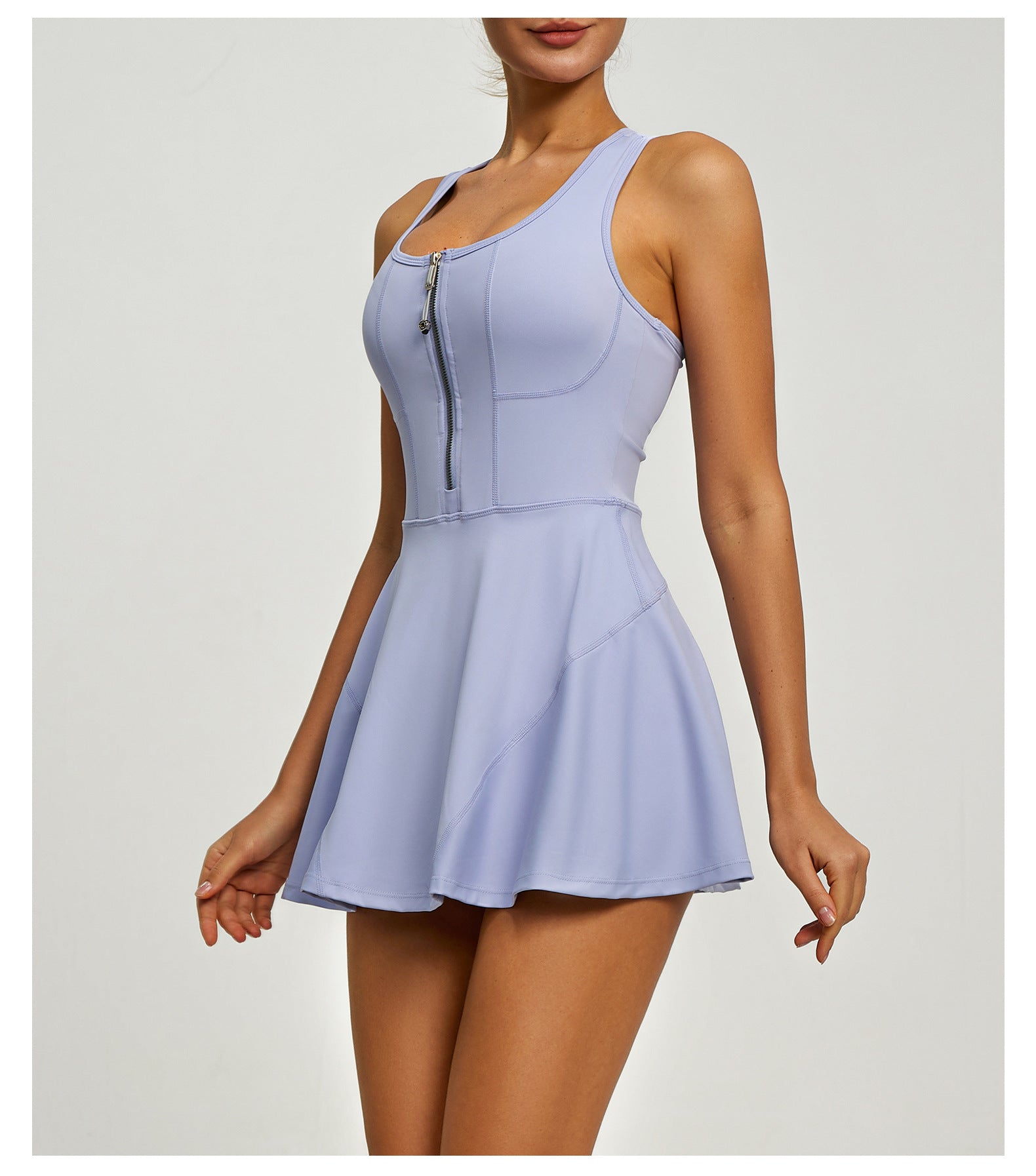 Light purple sleeveless dress with zipper detail on a white background