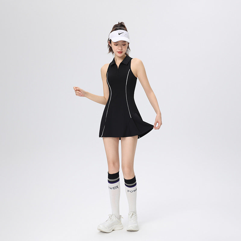 Woman wearing a black sleeveless dress with white accents on a white background