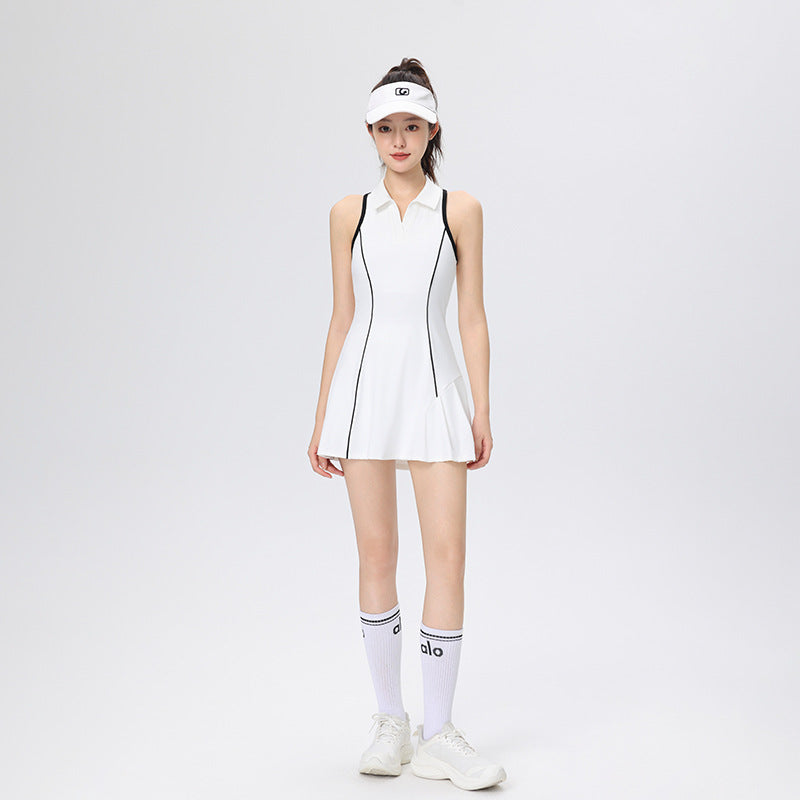 Woman wearing a white tennis dress and visor on a light gray background