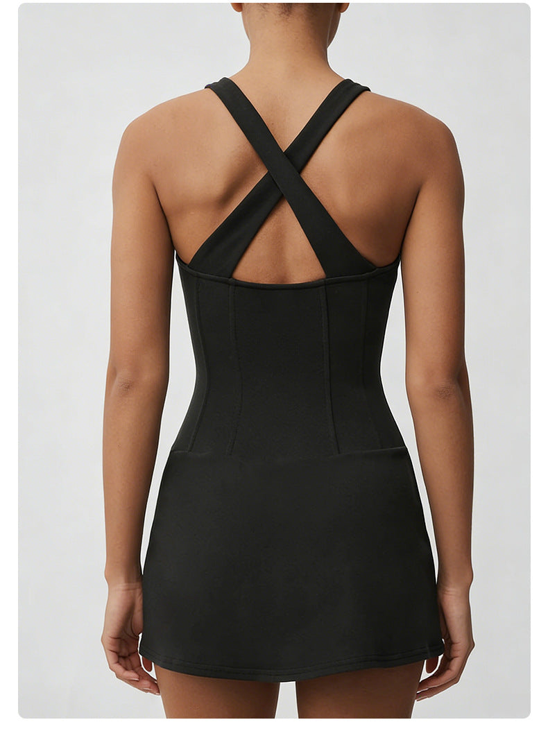 Black dress with criss-cross back design on a plain background