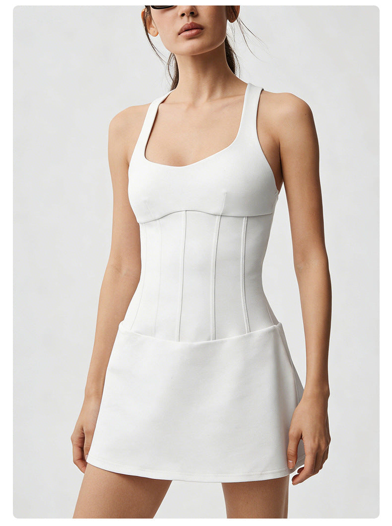 White sleeveless dress worn by a model on a light gray background