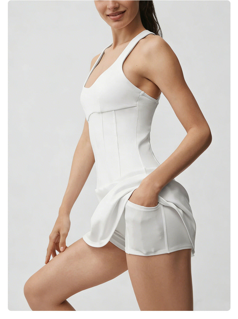 Woman wearing a white tennis dress on a light gray background
