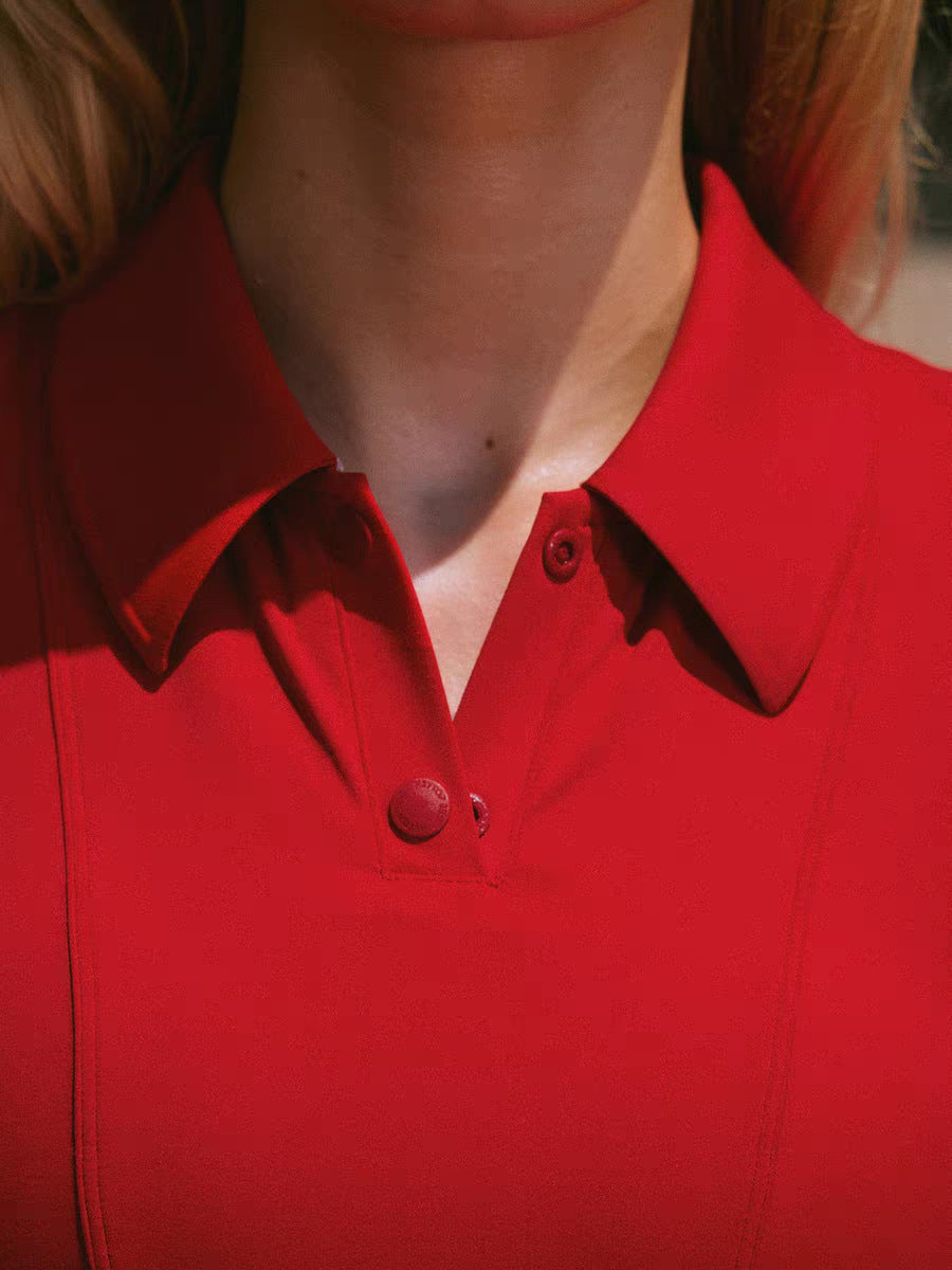 Close-up of a red polo shirt with a collar