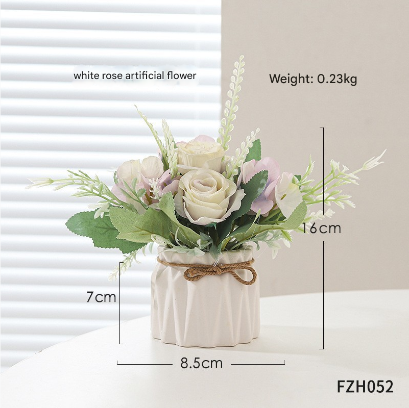 White rose in glossy pot, placed on white table
