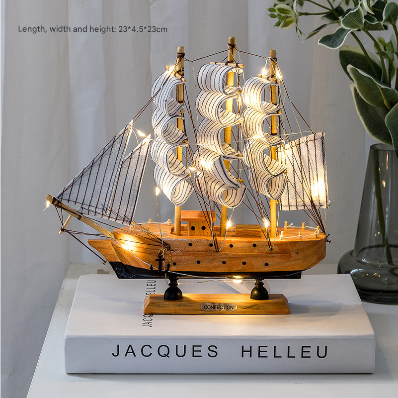 Sailboat on a Scandinavian shelf with books and flower vase
